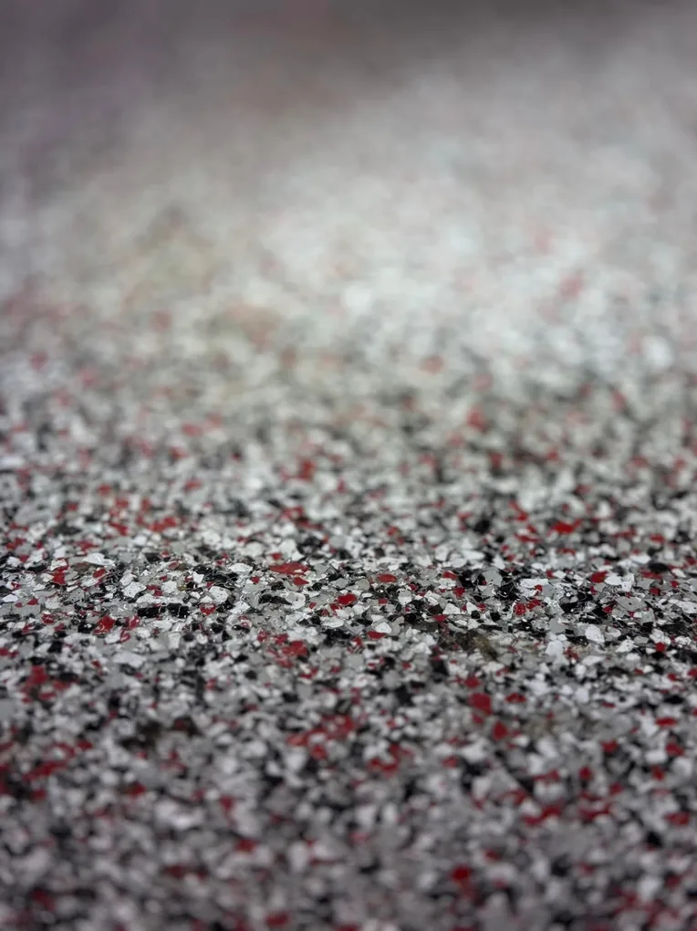 Close-up of a red, black, and white flake blend