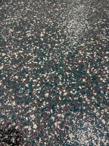 Close-up of a multi-color flake floor coating