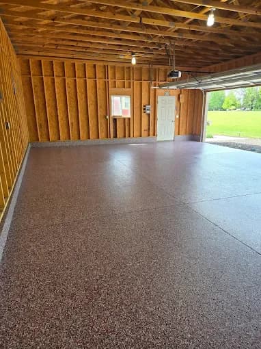 Brown flake floor coating in a pole barn