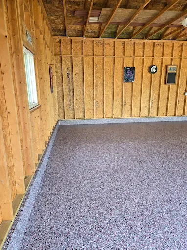 Large pole barn with a gray coated concrete floor